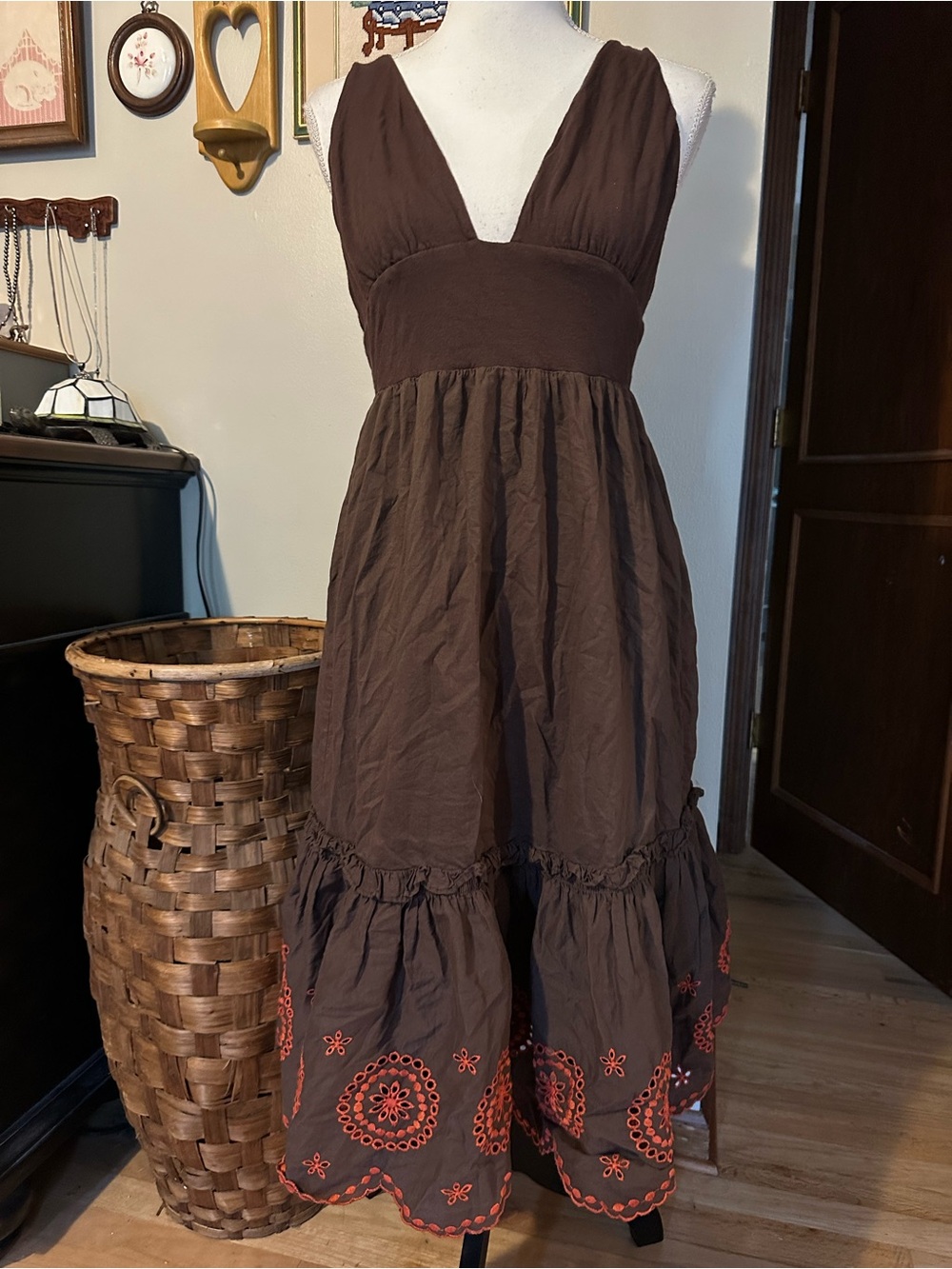 Brown maxi dress with orange eyelet embroidery and ruffles